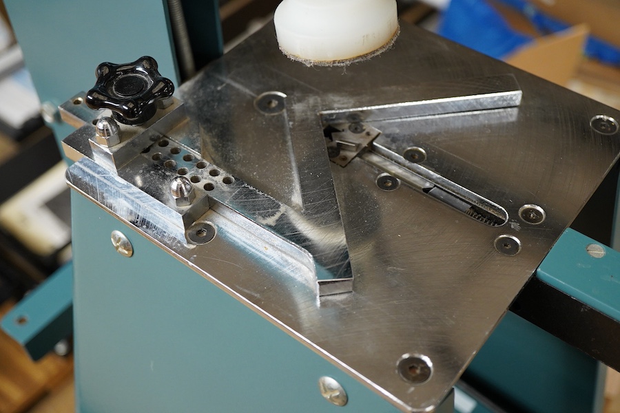 An Underpinner with two dissembled ‘arms’ and a box containing tools, accessories and manual